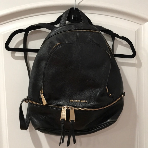 Michael Kors backpac with multiple pockets. Outside has some stains as pictured - Picture 1 of 15